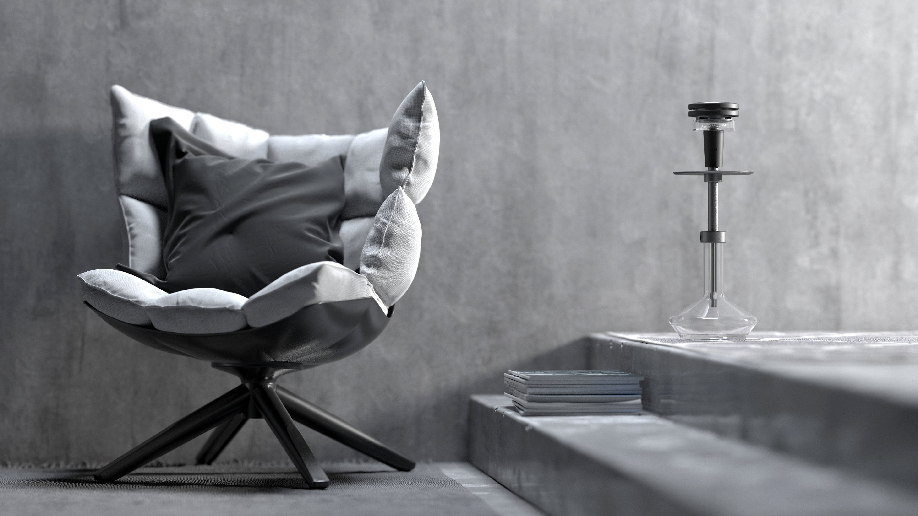 Quasar Raas 2 in a minimalistic setting, next to a stylish chair, showcasing its integration into home decor
