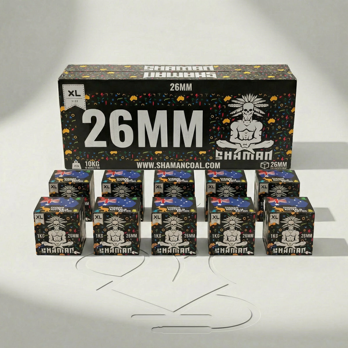 Shaman 26mm coconut charcoal 10kg master box at a three-quarter angle showing the front face and Australia Edition side panel in a professional studio setting., image 7 of 15