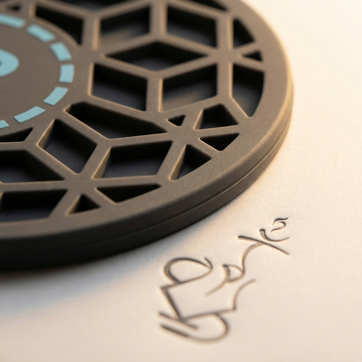 Close-up macro of the 320° Hookah Base Mat's bespoke cube-pattern top face, showing the three-dimensional recessed silicone lattice and soft matte finish., image 6 of 15