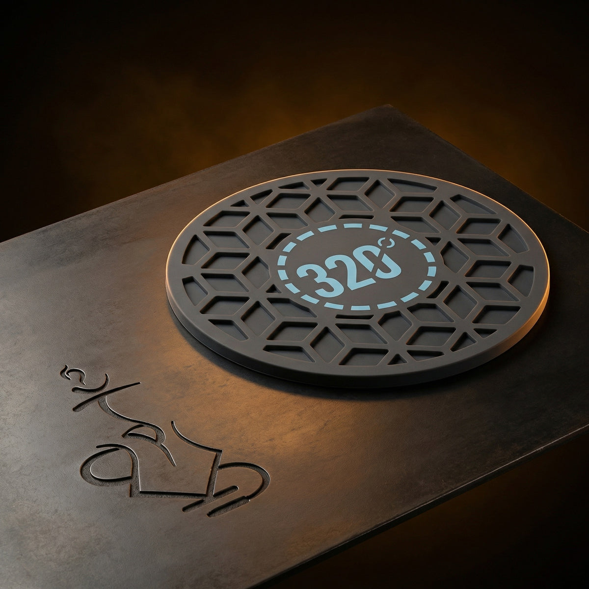 320° Hookah Base Mat in Black & Blue photographed in a warm dark editorial studio, showcasing the light blue 320° medallion and recessed cube-lattice silicone top face., image 3 of 15