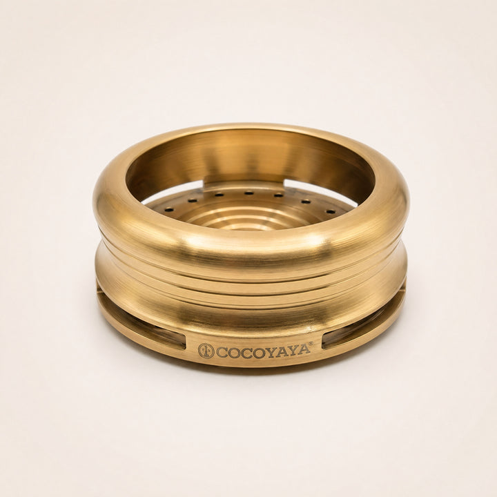 Cocoyaya Pro 5 stainless steel HMD in brushed gold finish, three-quarter studio view showing slot vents and COCOYAYA branding