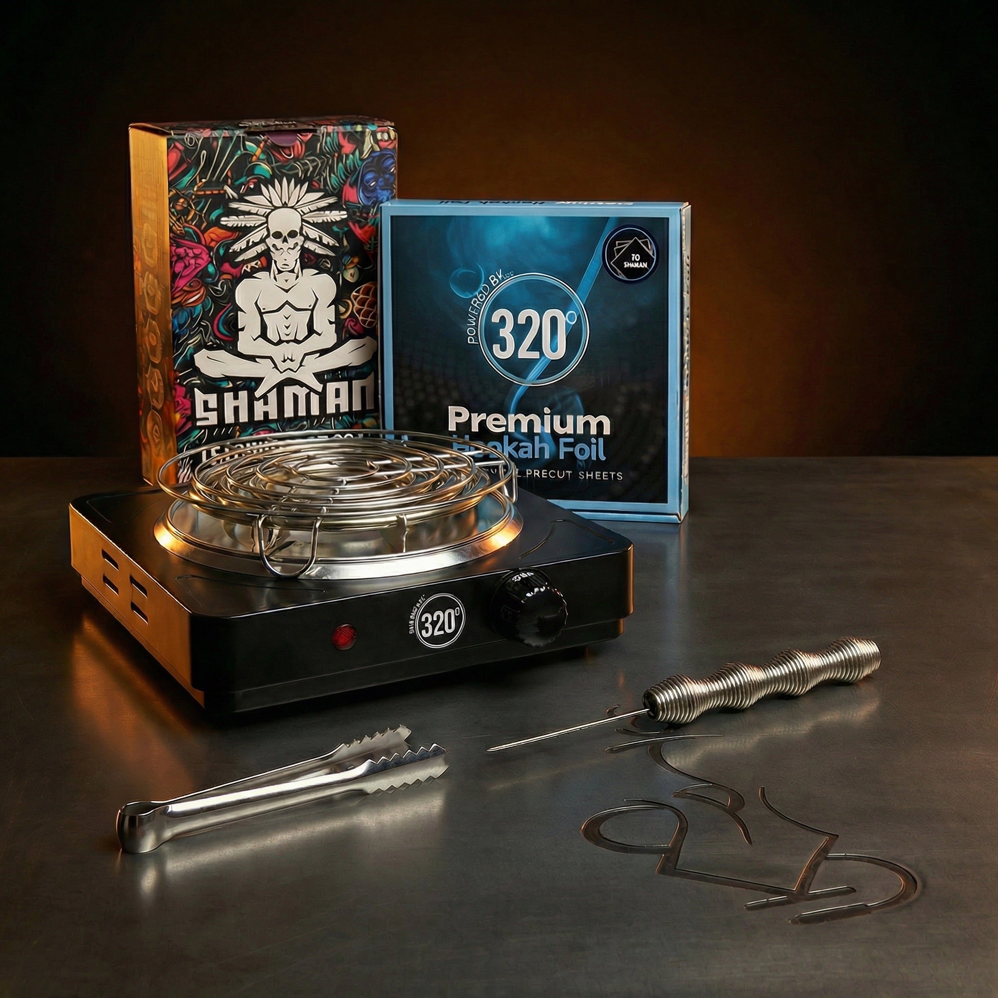 The Premium Way complete shisha prep kit bundle lit dramatically against a warm dark editorial backdrop, showing the 320 electric burner, Shaman Hexa charcoal, premium foil, Smoothpoke poker and tongs.
