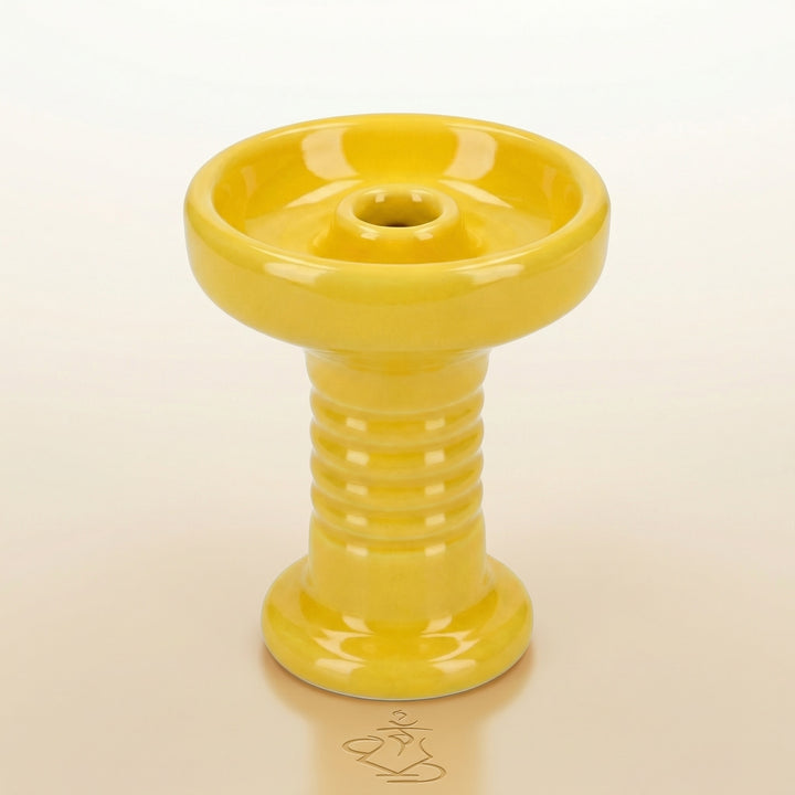 Essentials Glazed Phunnel Bowl in bright yellow, handmade clay with glossy glaze, showing the wide rim, concave basin, raised central spire, and ribbed stem in a clean studio setting.