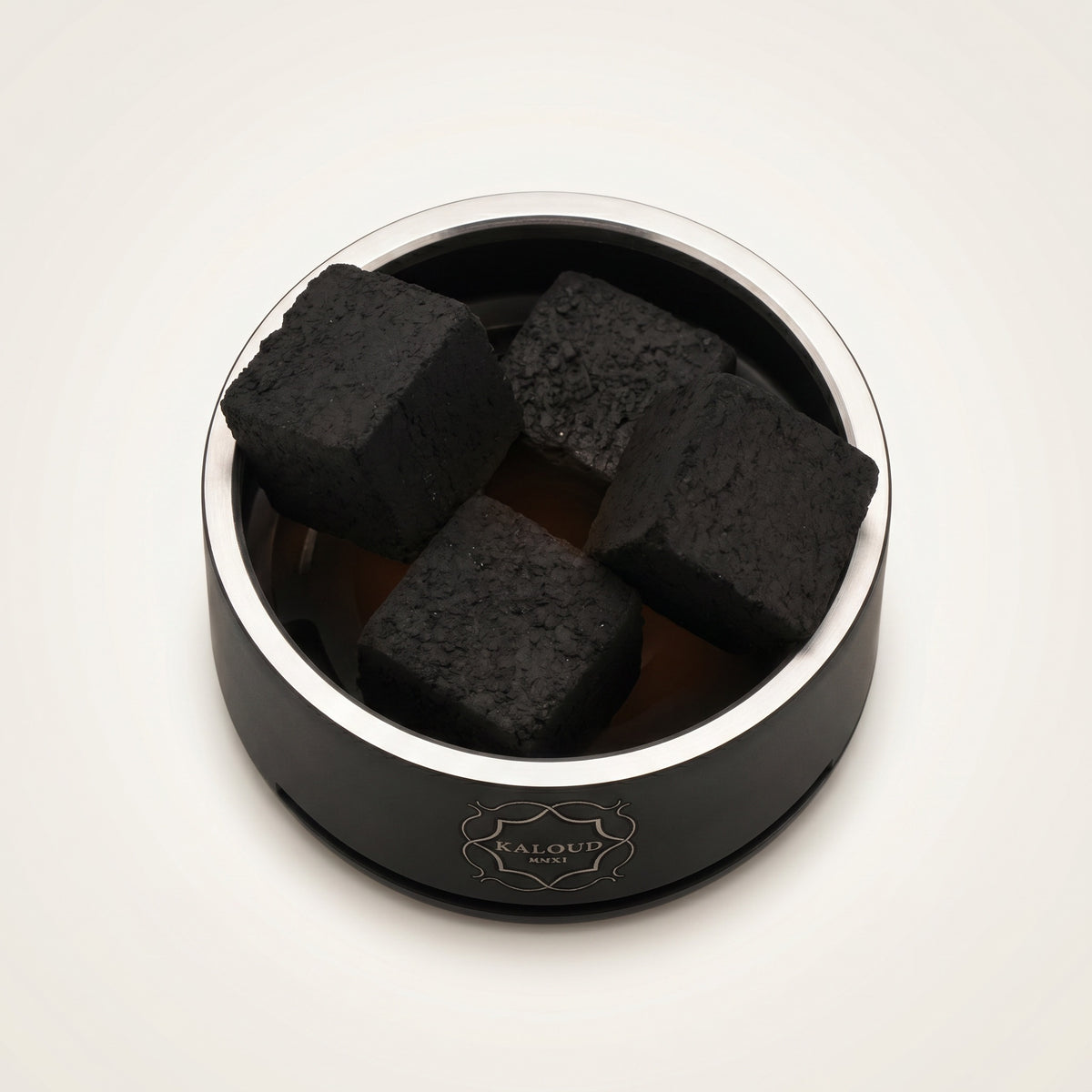 Top-down view of Kaloud Lotus I+3 Niris Black HMD chamber holding four large coconut coals, image 3 of 10