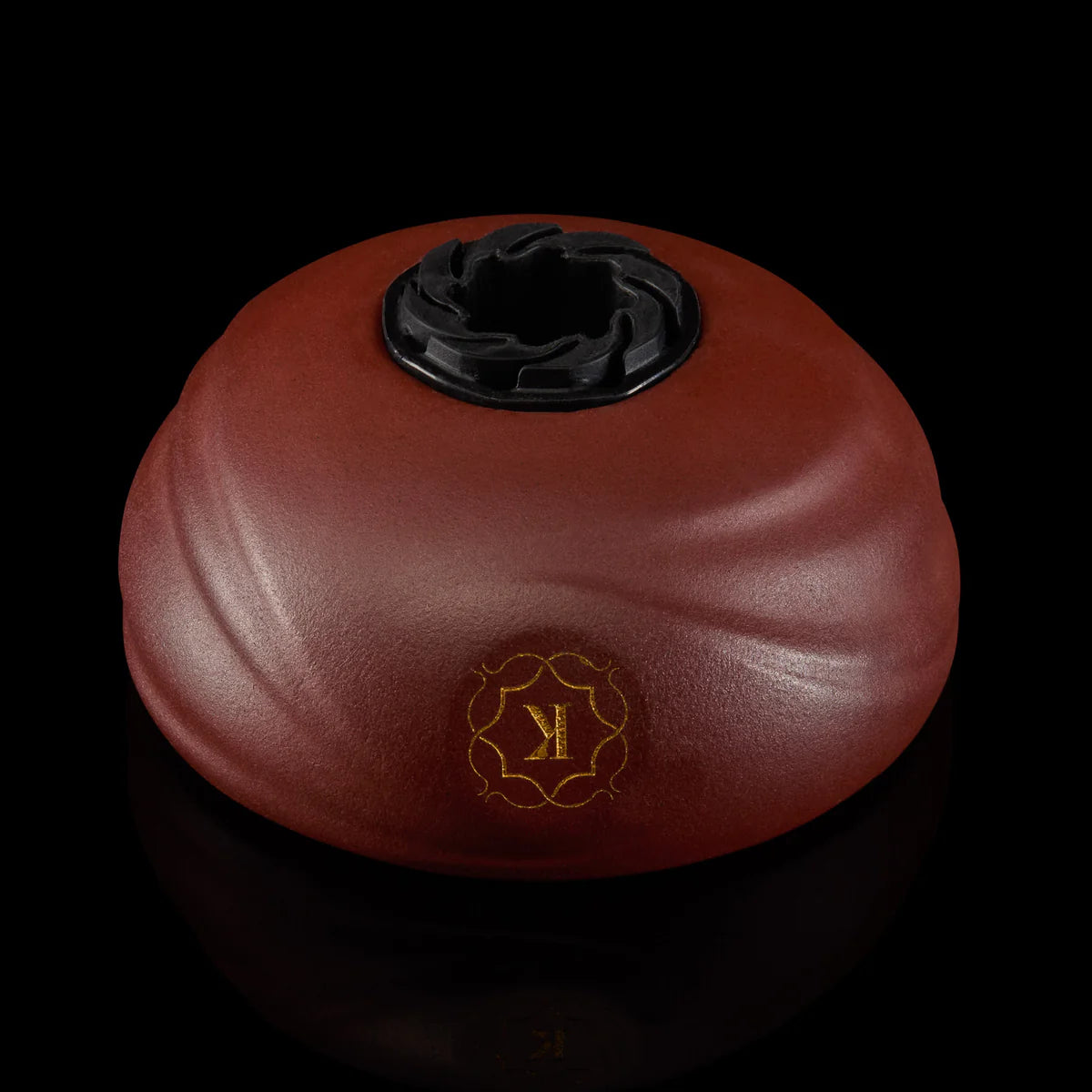 Underside view of Kaloud Samsaris Kore Qì Short red clay hookah bowl showing integrated silicone grommet