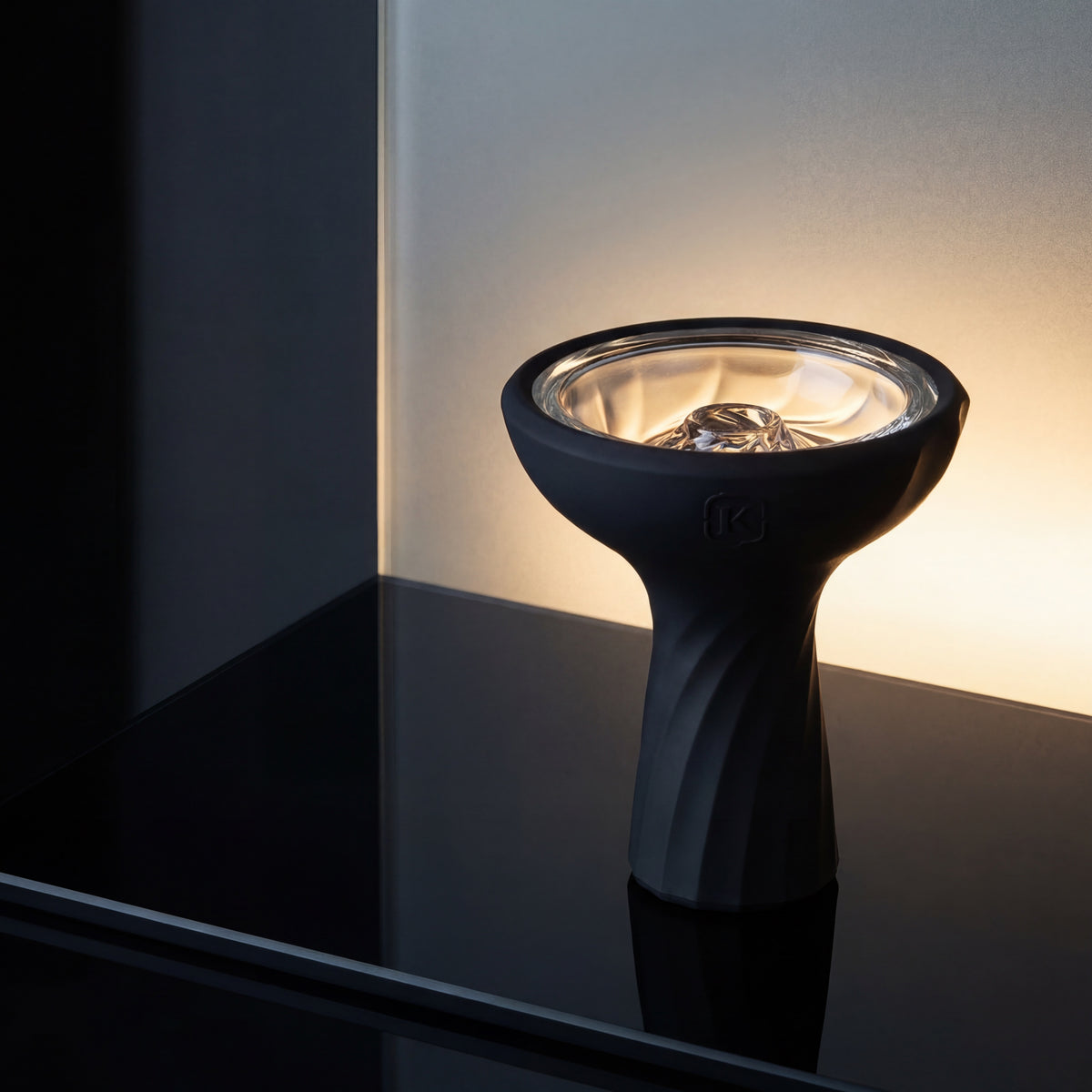 Kaloud Samsaris Vitria III borosilicate glass shisha bowl on polished black glass surface with frosted glass plane backlighting the clear basin, image 2 of 12