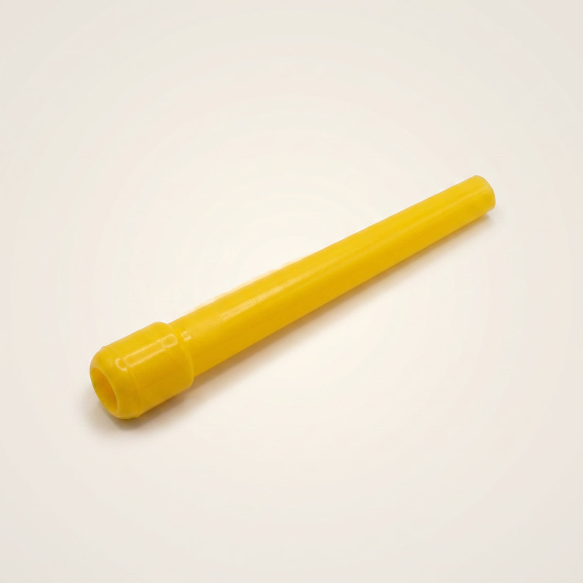 Close-up of a single Khalil Mamoon disposable shisha mouthpiece tip showing the flanged hose-end cap and tapered yellow plastic body, image 5 of 10