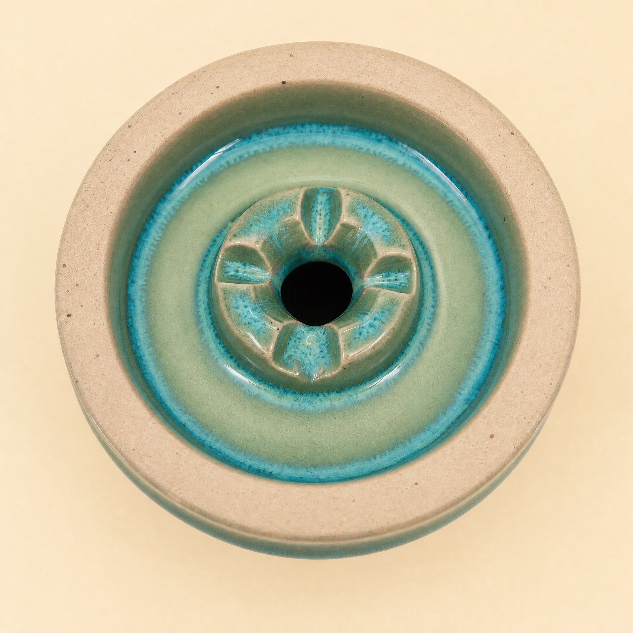 MIT Luxury Ashera Cedar bowl macro top-down detail of teal-sage glaze pooling around the phunnel spire