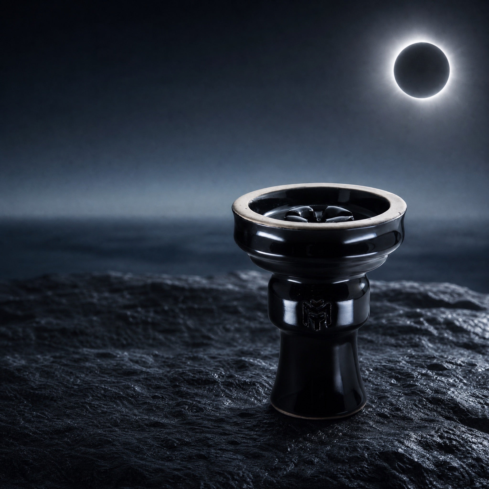 MIT Luxury Ashera Eclipse bowl on weathered stone at total solar eclipse, dark Mediterranean coast