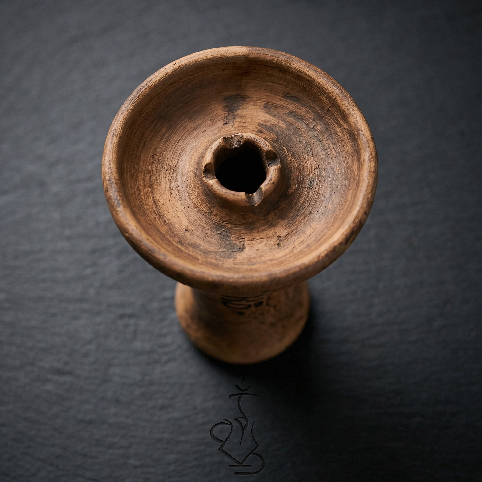 Oblako Phunnel S unglazed shisha bowl top-down macro showing crater-shaped phunnel hole and handmade Russian stoneware texture