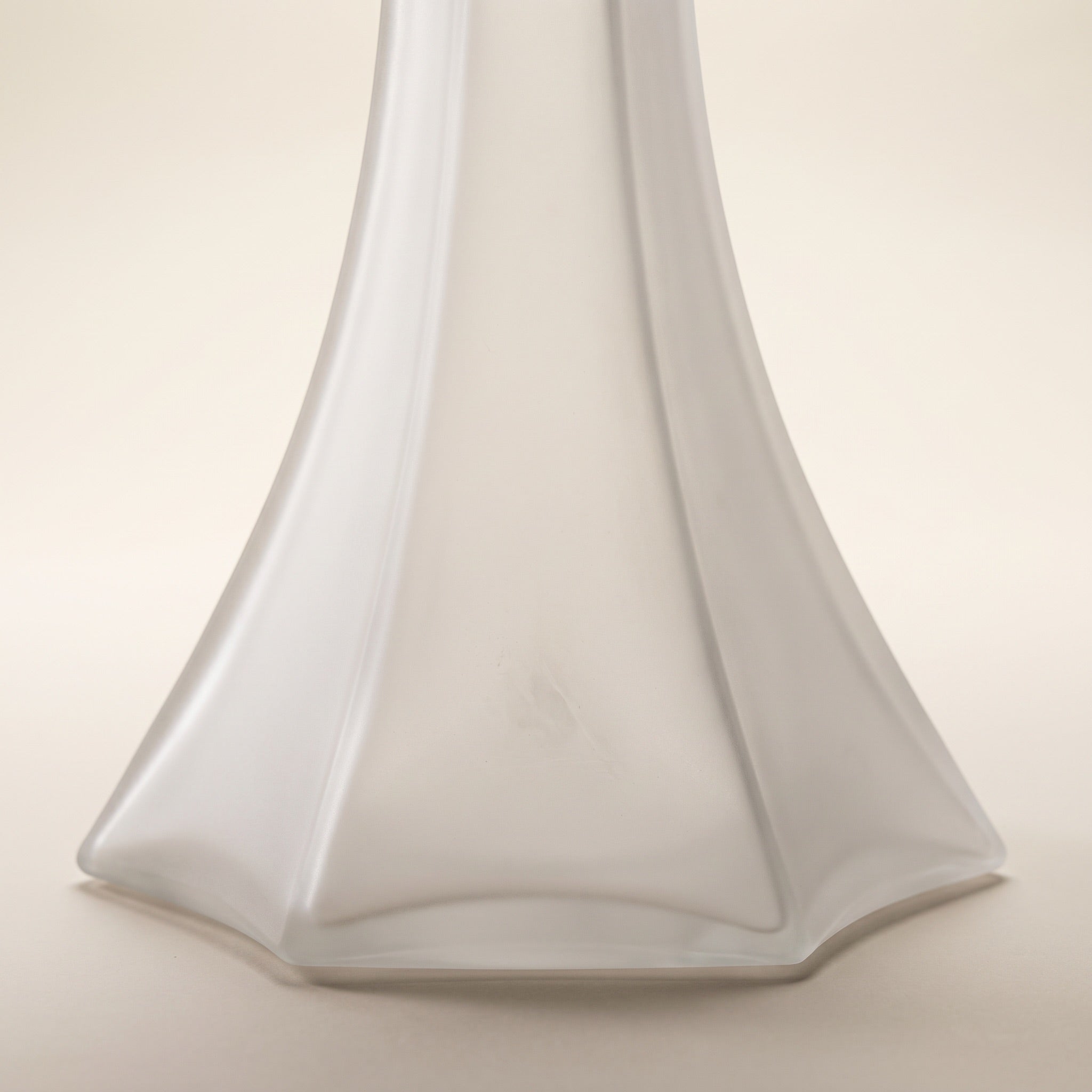 OVO x Neolux Frosty White hookah base close-up showing six-facet splayed skirt geometry and frosted glass finish, The Premium Way