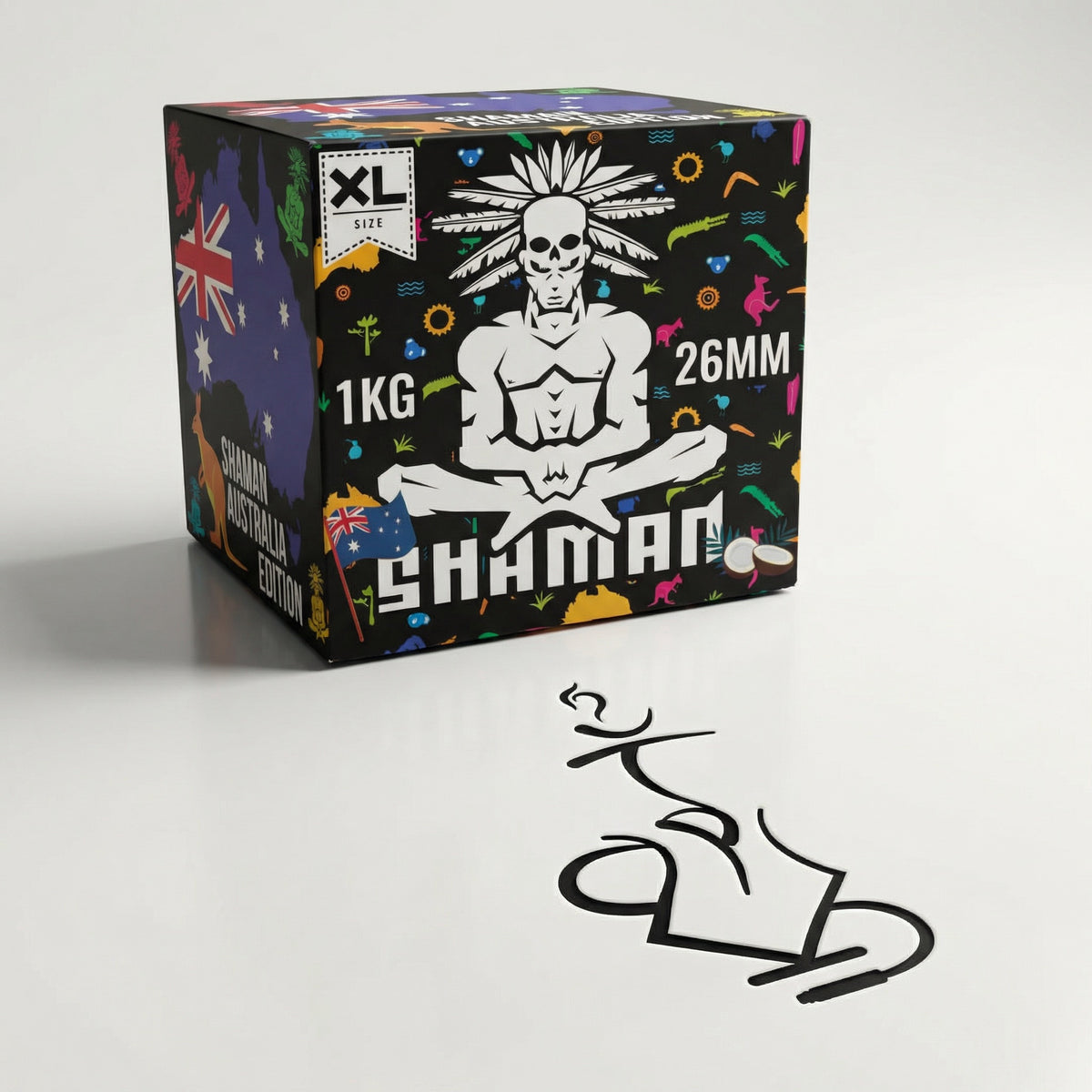 Shaman 26mm coconut charcoal 1kg box at a three-quarter angle showing the skull mascot and Australia Edition panel in a professional studio setting., image 5 of 15