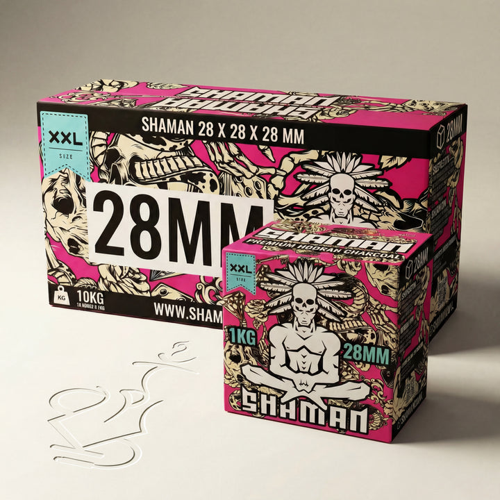Shaman 28mm coconut shisha charcoal 10kg master case alongside 1kg box showing size comparison between both packaging options on warm white studio background
