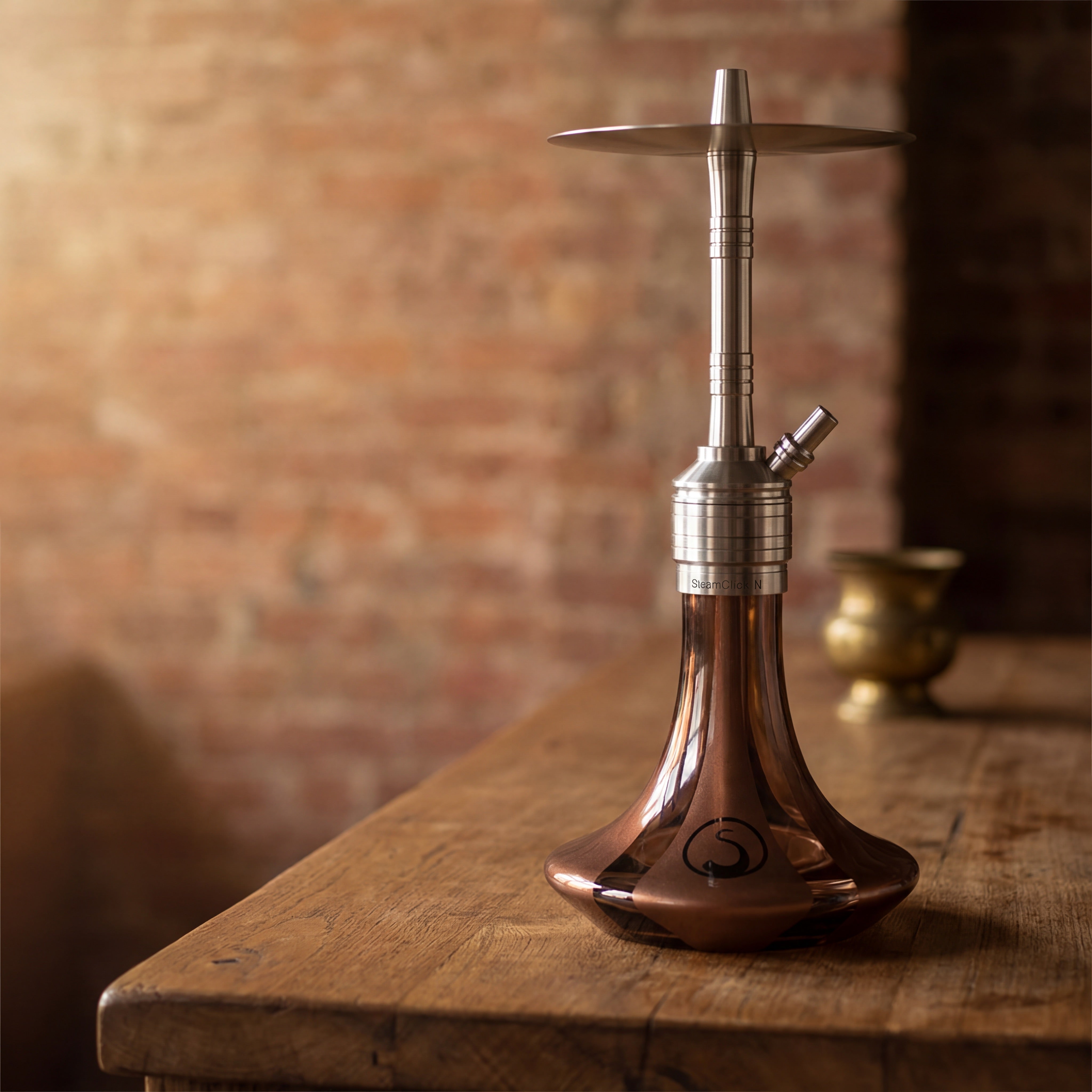 Steamulation Mini Gen II Copper Metallic on reclaimed wood counter in Melbourne warehouse interior, warm industrial setting