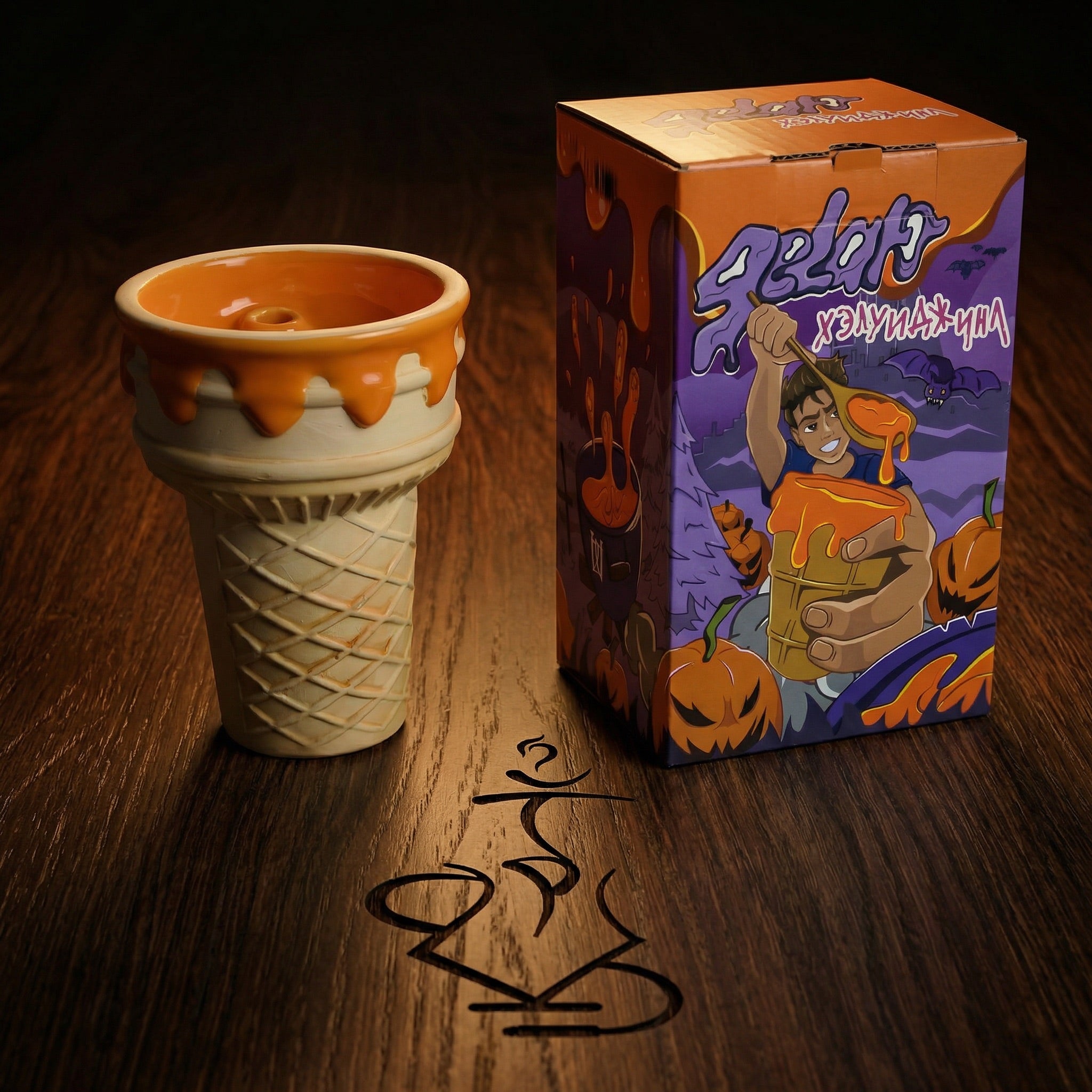 Werkbund Gelato Pumpkin Drip Halloween Edition bowl displayed beside its illustrated purple and orange collector's box on dark oak, a limited hand-numbered release available online from The Premium Way.