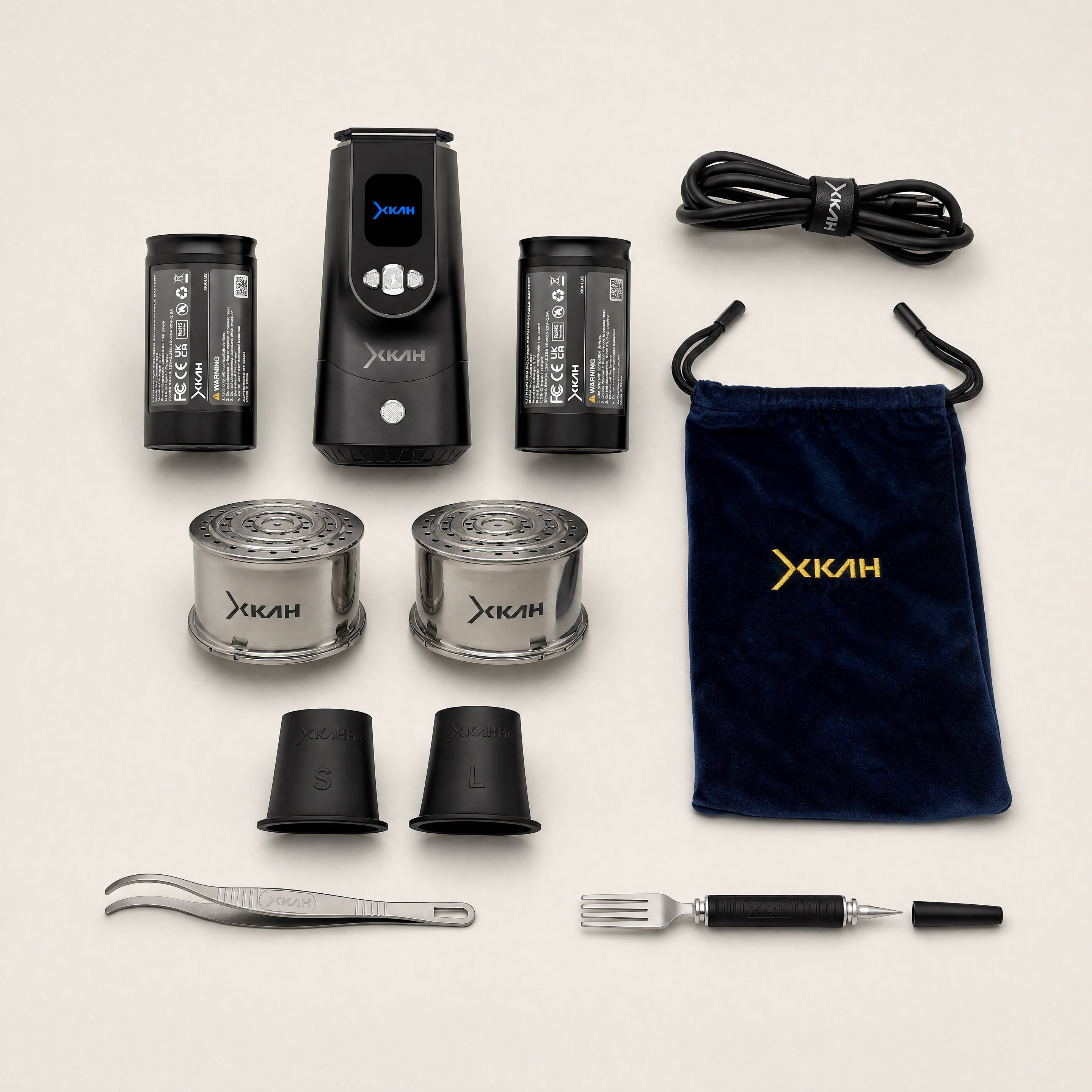 XKAH Pro Essentials Bundle full kit — device, two batteries, two bowls, tongs, fork poker, grommets, cable, bag.