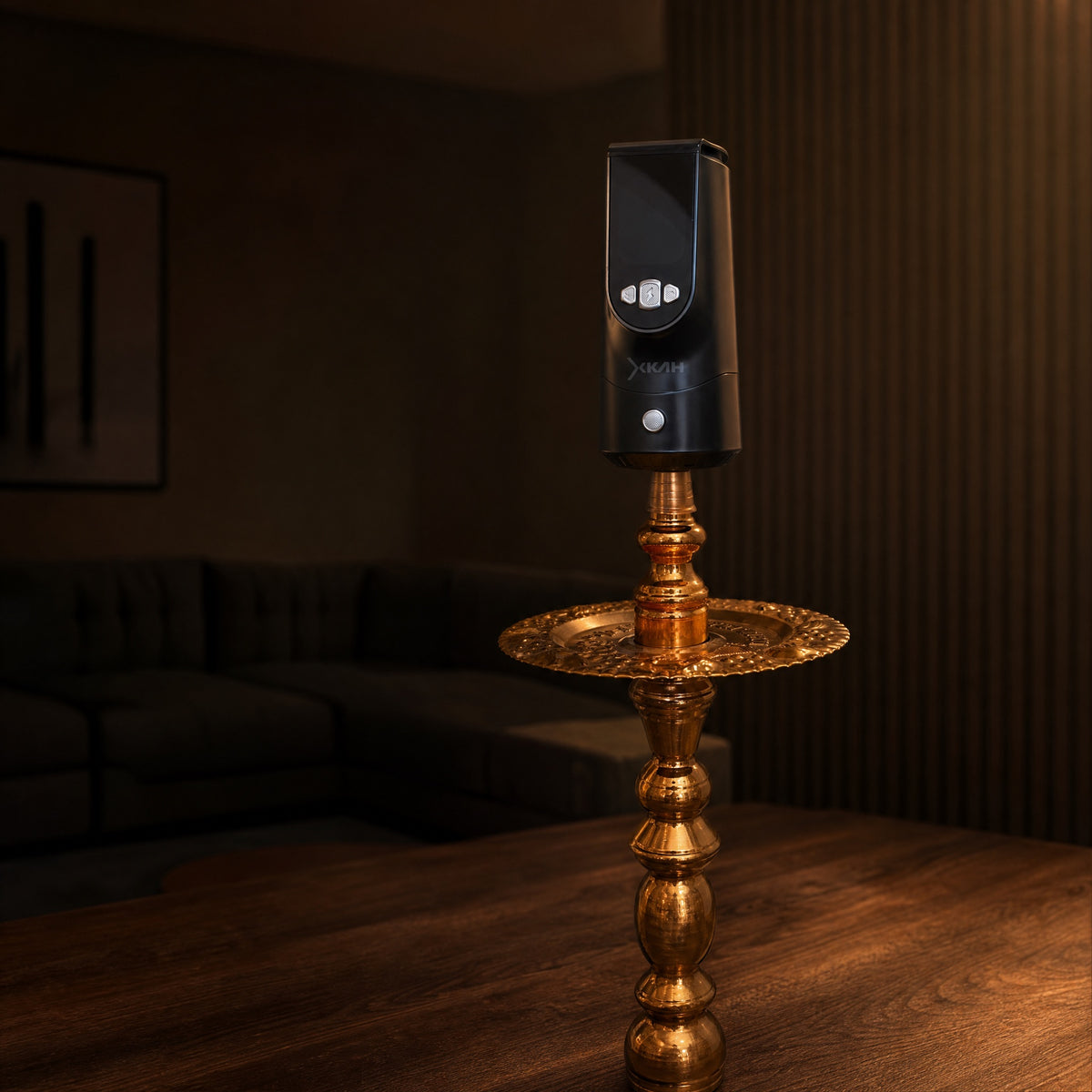 XKAH Pro mid-session on a traditional brass shisha, evening room dimmed deep into the ritual, display glowing cool., image 12 of 28
