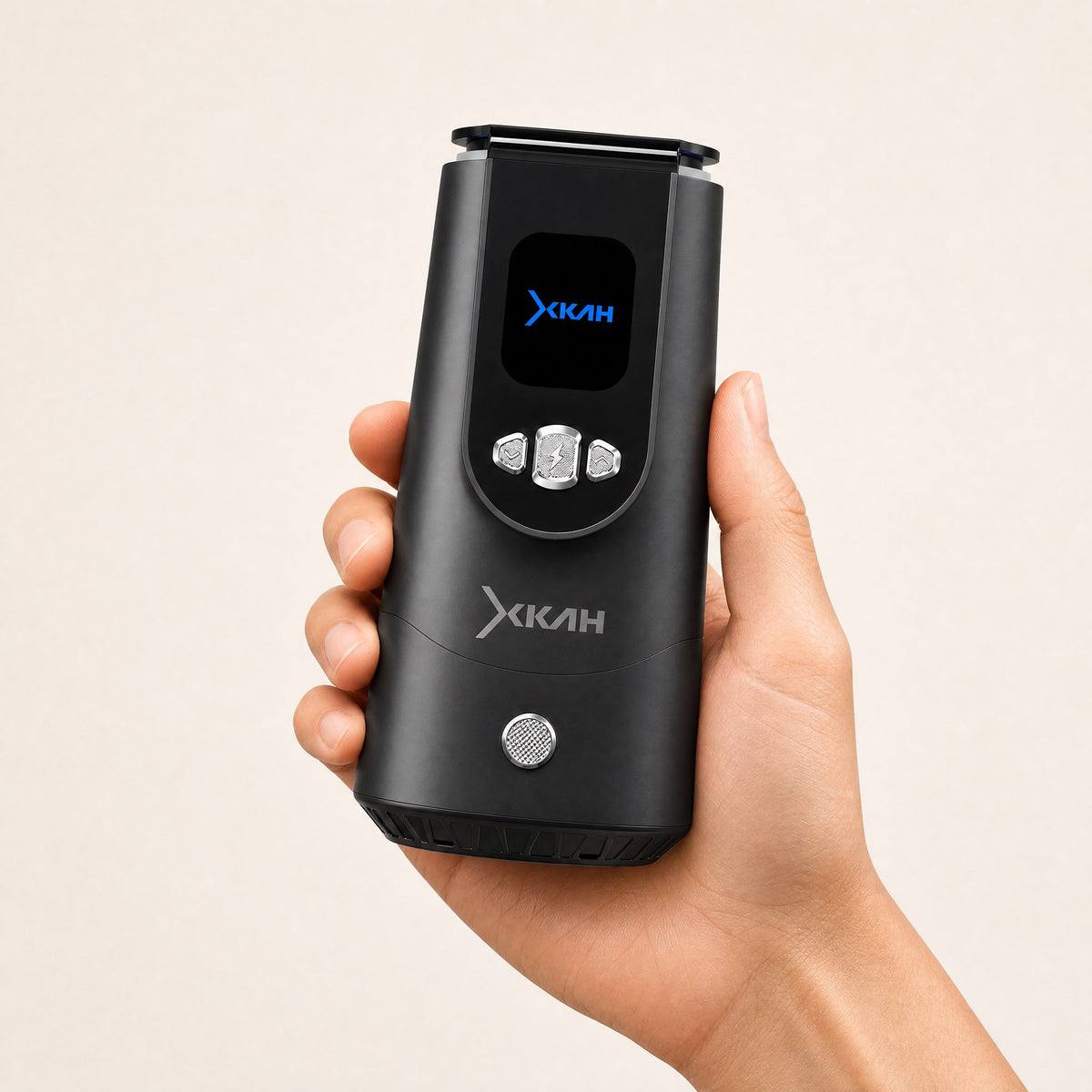Hand holding the XKAH Pro electronic heat management device, showing its portable size and natural grip., image 11 of 28