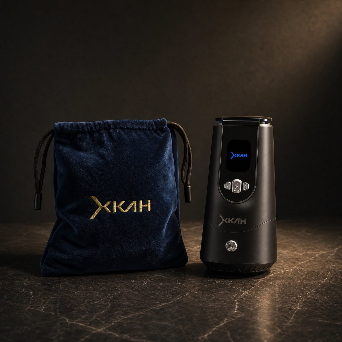 XKAH Pro electronic heat device with its navy velvet drawstring travel bag, on polished stone — travel-ready set., image 13 of 28